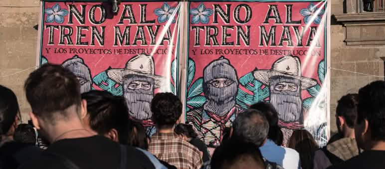 Tempranamente, Salva la Selva comprendió los riesgos del proyecto del Tren Maya para la población indígena y rural, apoyando sus reclamos. Pancarta "No al Tren Maya"